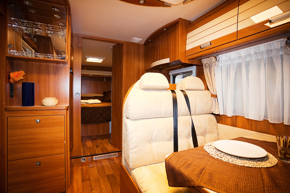 dining space and interior of a modern motorhome seen while preforming rv inspection services